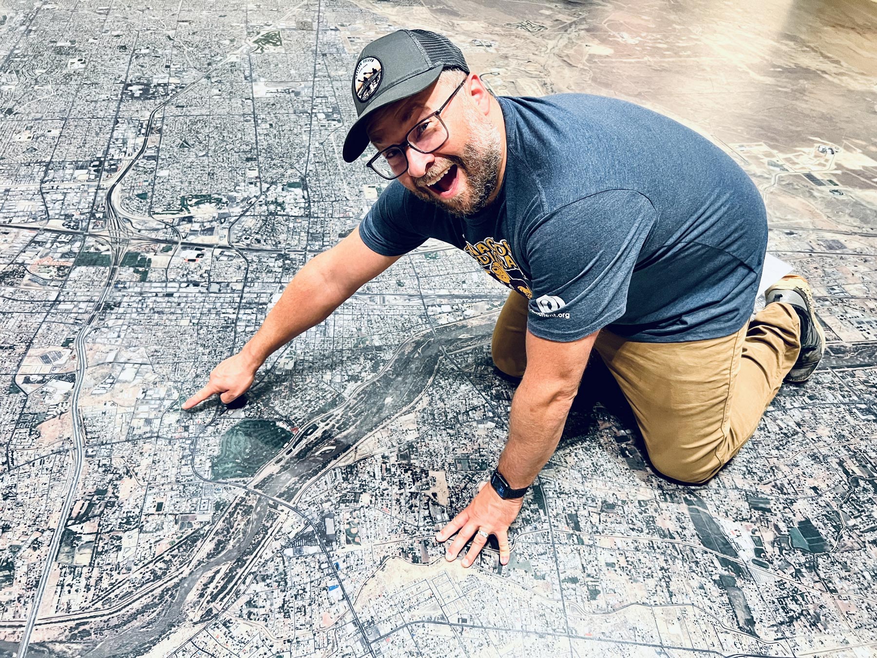 Robert points at a floor map